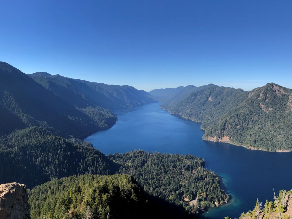 Deep Blue Lake Crescent with evergreen mountains surrounding. Mount Storm King, WA