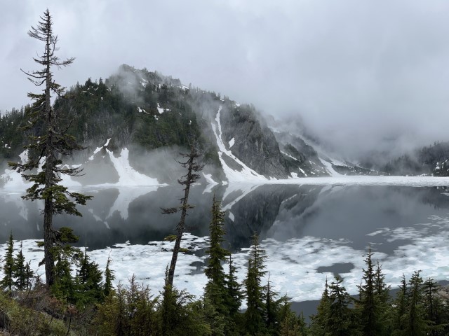 Half frozen alpin lake from Snow Lake trail. Snoqualmie Pass, WA